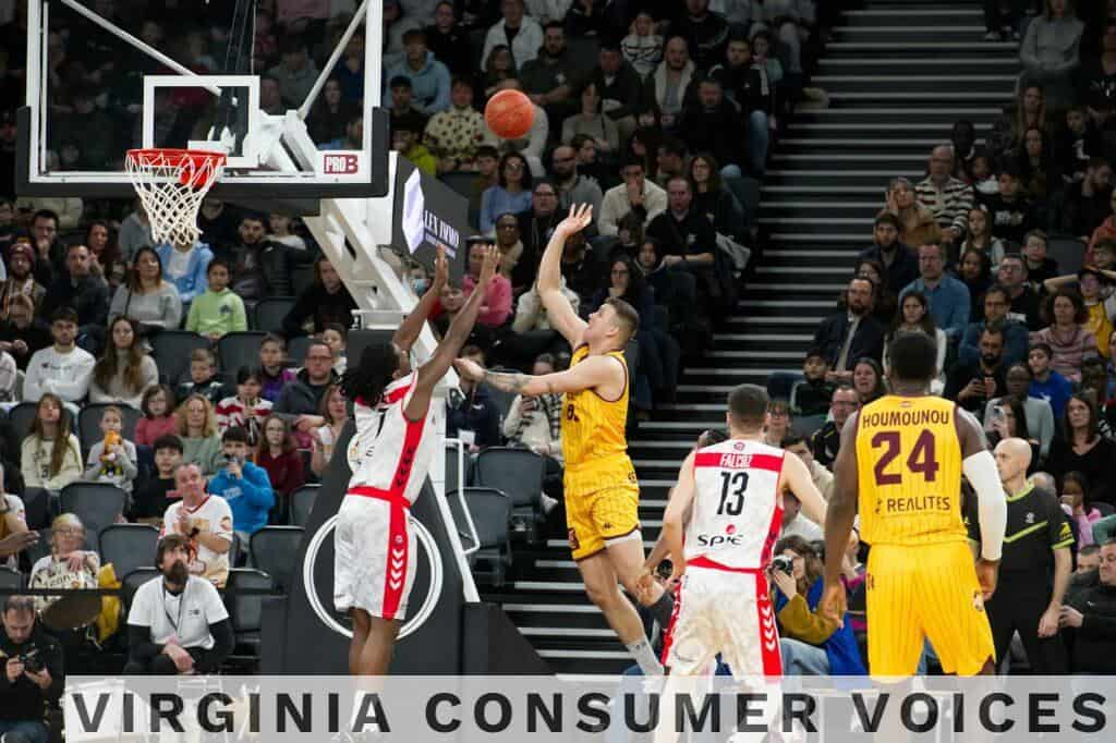 Dramatic moment in a basketball game with players and an engaged crowd.