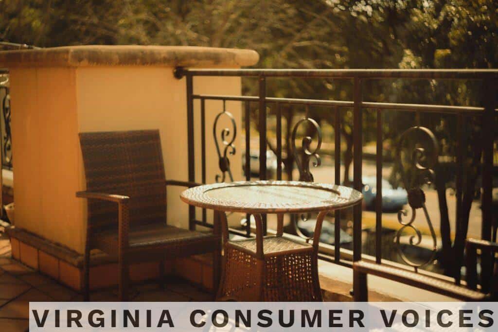 Warm, inviting outdoor patio with wicker chair and table perfect for relaxation.