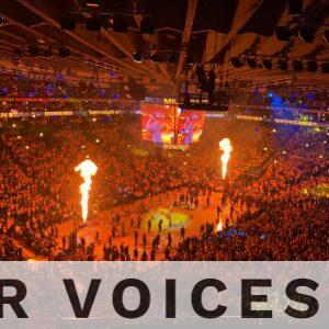 Lively basketball event with a huge crowd and fiery show in Oakland arena, capturing the vibrant sports atmosphere.